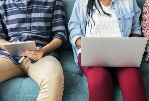 2 people on laptop and tablet