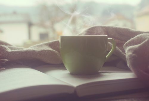 Cup of tea on an open book