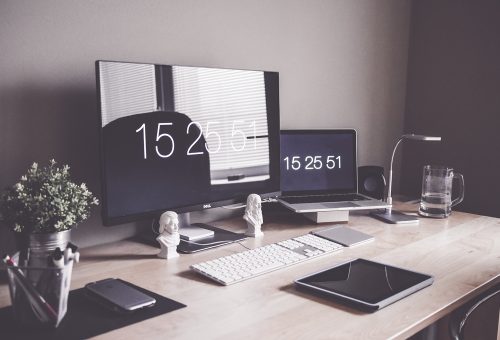 Modern office setup with laptop and screen