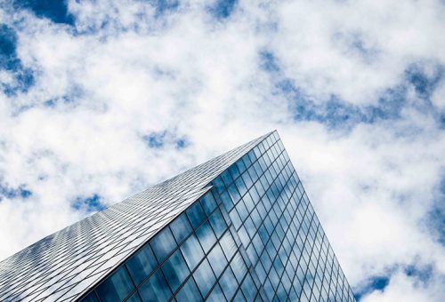 Building with cloudy sky background