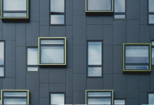 Windows on a grey tiled wall
