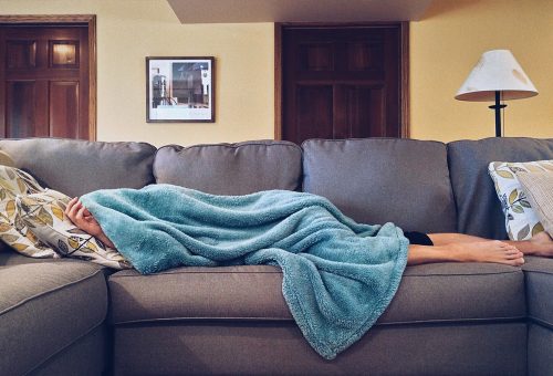 Person sleeping on sofa