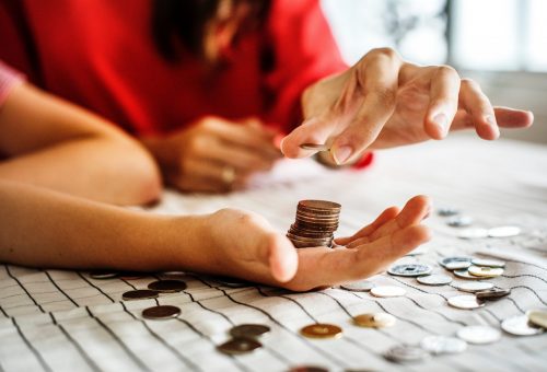 Stacks of coins in a hand