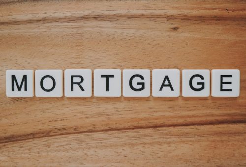 Wooden letter tiles spelling MORTGAGE