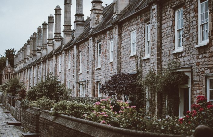 Row of ivy-covered stone cottages