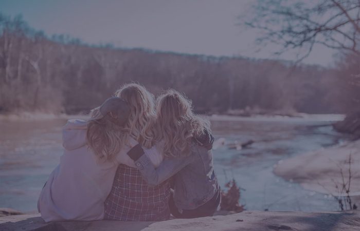Two people embracing outdoors in winter