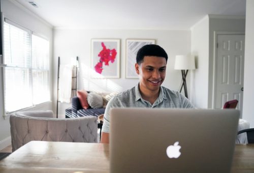 Man using a laptop at home