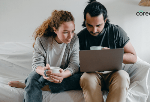 Couple looking at a laptop together
