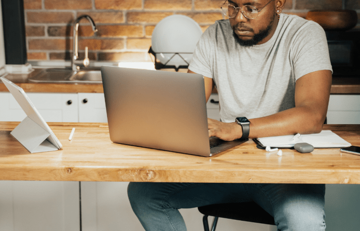 Man using a laptop at a desk