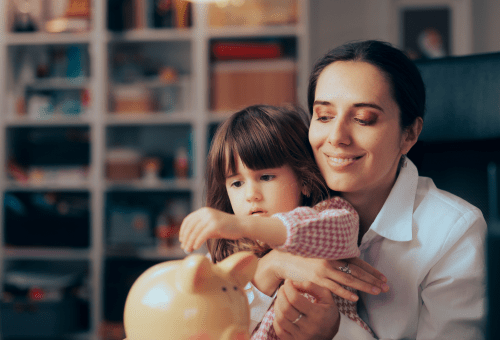 Parents with a child at home, bookshelf in the background